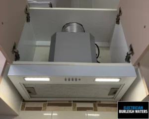 Close-up view of a ceiling-mounted air conditioning vent with ductwork visible.